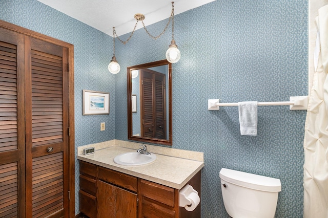 bathroom with vanity and toilet