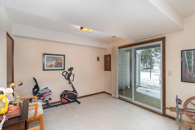 workout area with a textured ceiling