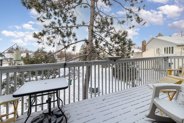 view of snow covered deck