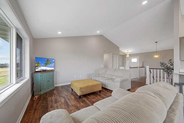 living room featuring dark hardwood / wood-style floors and lofted ceiling