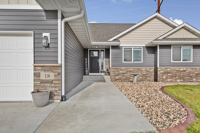 doorway to property featuring a garage