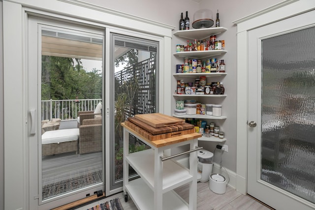 doorway to outside with baseboards