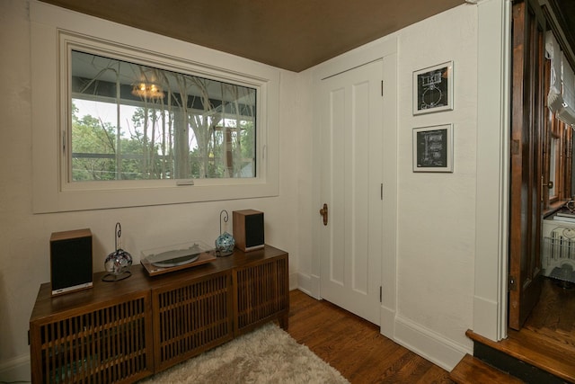 office space featuring baseboards and wood finished floors