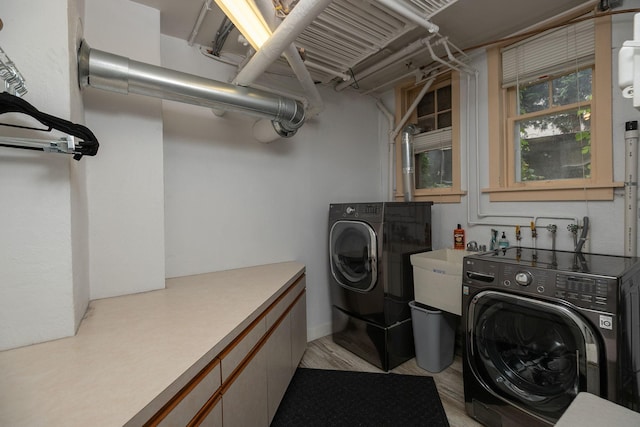 laundry area with washing machine and clothes dryer