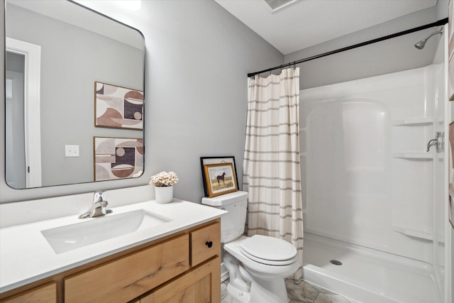 bathroom with a shower with curtain, tile patterned flooring, vanity, and toilet