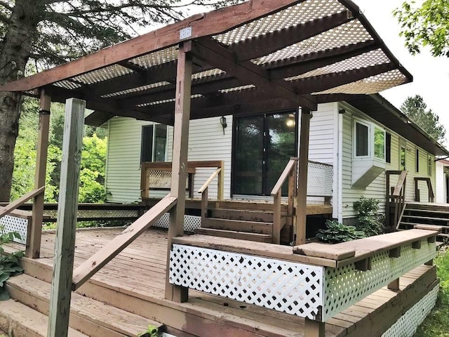 wooden terrace featuring a pergola