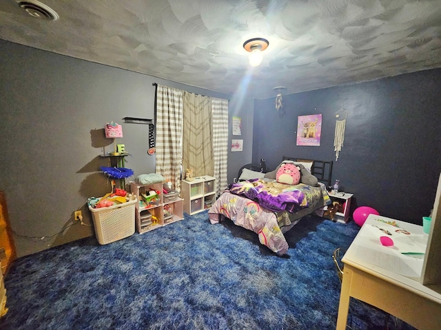 bedroom featuring carpet and visible vents