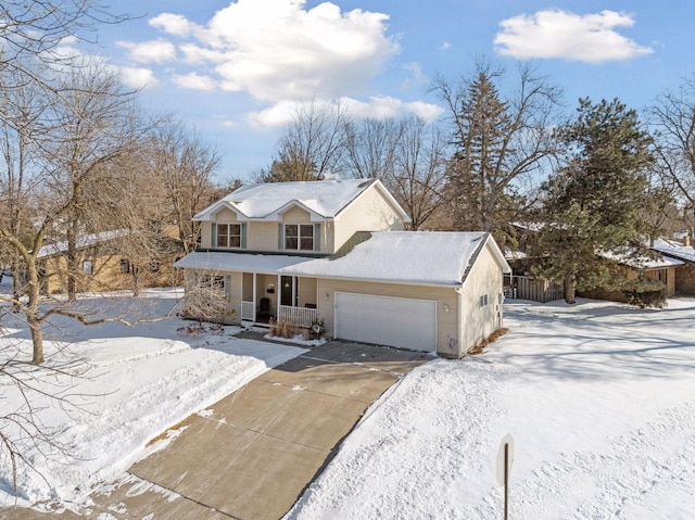 view of front property featuring covered porch and a garage