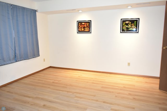 empty room with light wood-type flooring