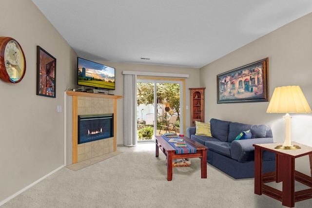 living room with a fireplace and light colored carpet