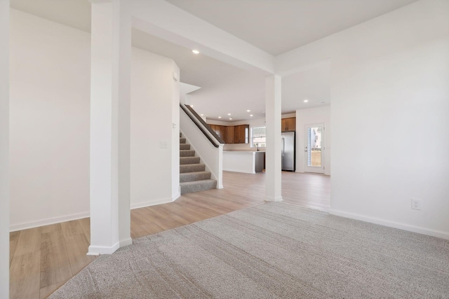 foyer entrance with light hardwood / wood-style flooring