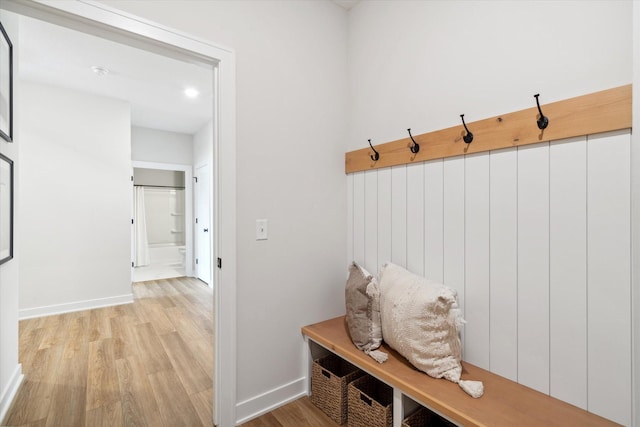 mudroom with light hardwood / wood-style flooring