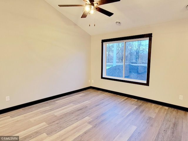 unfurnished room featuring light hardwood / wood-style flooring, ceiling fan, and lofted ceiling