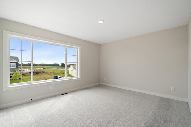 unfurnished room featuring carpet flooring