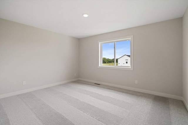 spare room featuring carpet flooring