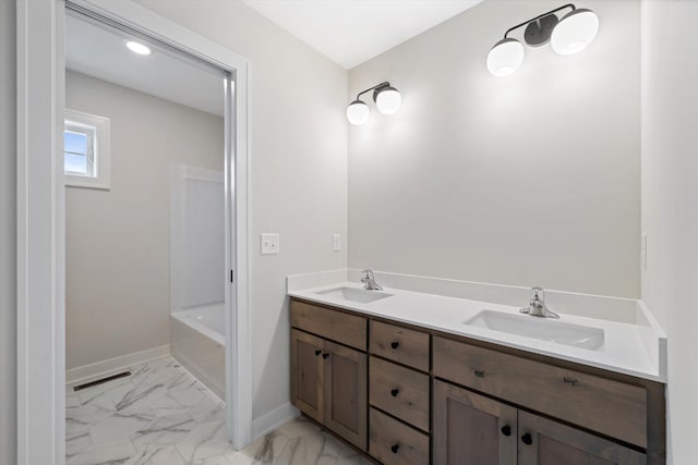 bathroom with a bathing tub and vanity