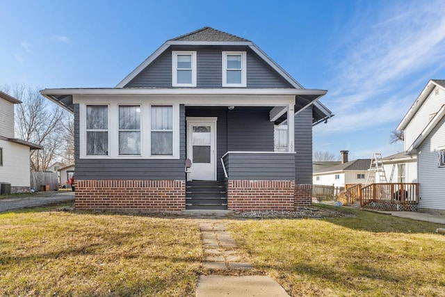 bungalow with a front lawn