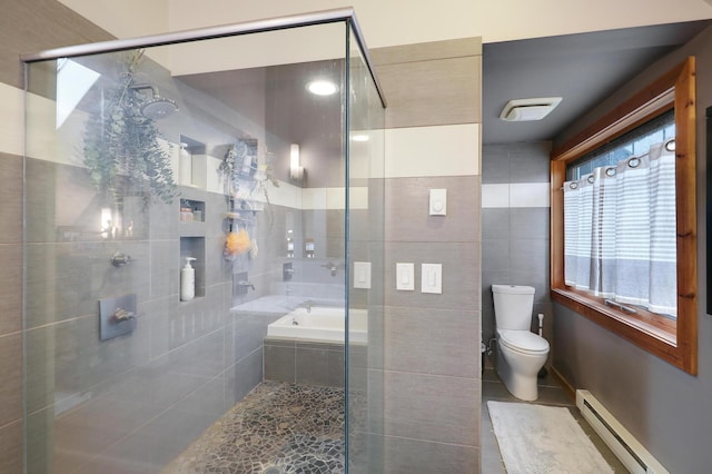 bathroom with tile patterned flooring, toilet, tiled shower, a bath, and a baseboard radiator