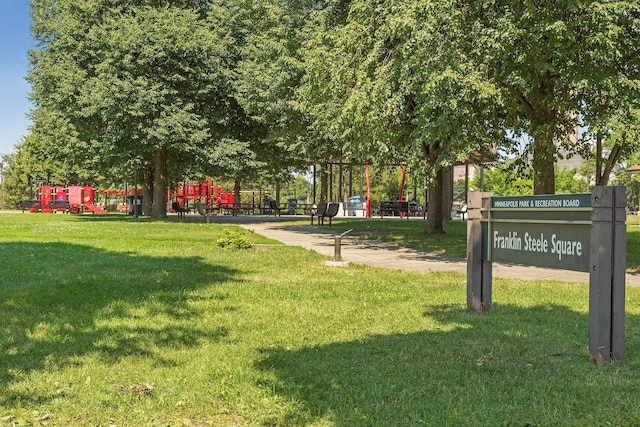 view of community with a lawn and playground community