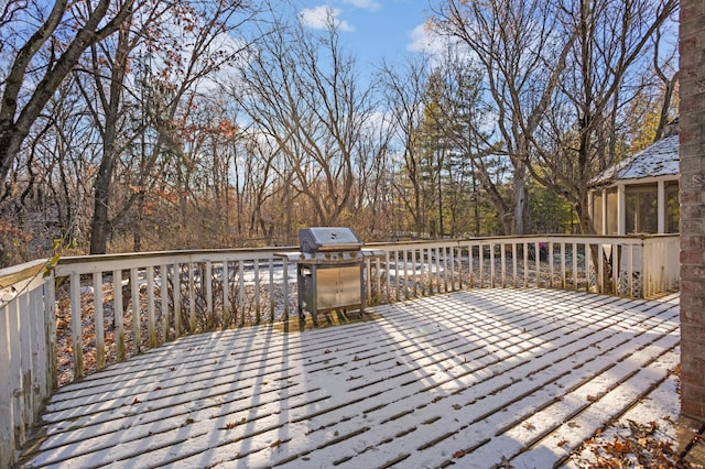 wooden deck with a sunroom