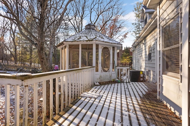 wooden terrace featuring a gazebo and central AC unit