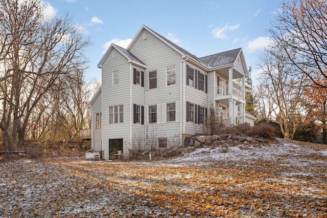 view of side of property with a balcony