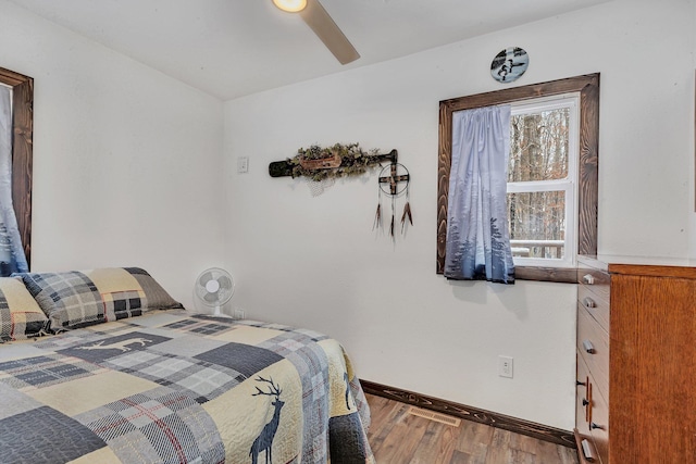 bedroom with ceiling fan and hardwood / wood-style floors