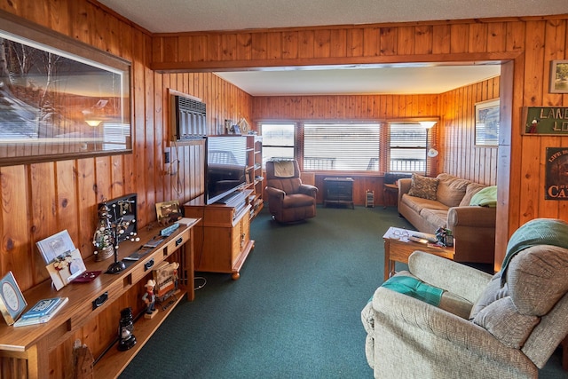 carpeted living room featuring wood walls and a textured ceiling