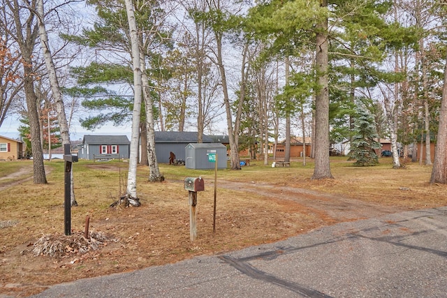 view of front of house with a storage shed