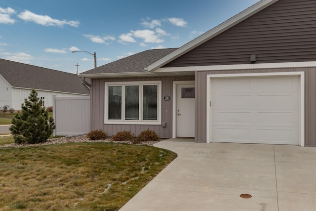 ranch-style house with a front lawn and a garage