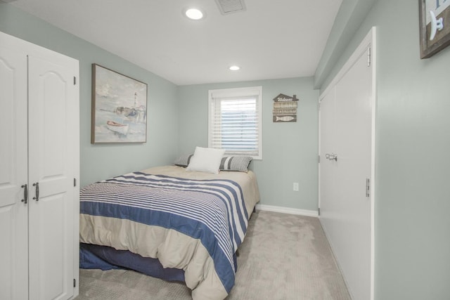 bedroom featuring light colored carpet