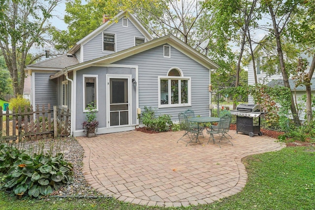 rear view of property featuring a patio area