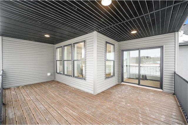 unfurnished sunroom with wooden ceiling