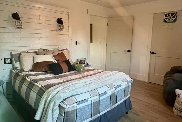 bedroom with hardwood / wood-style floors