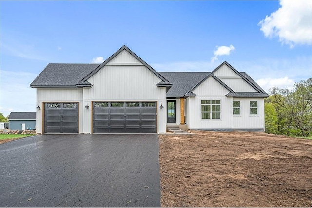 modern farmhouse style home with a garage