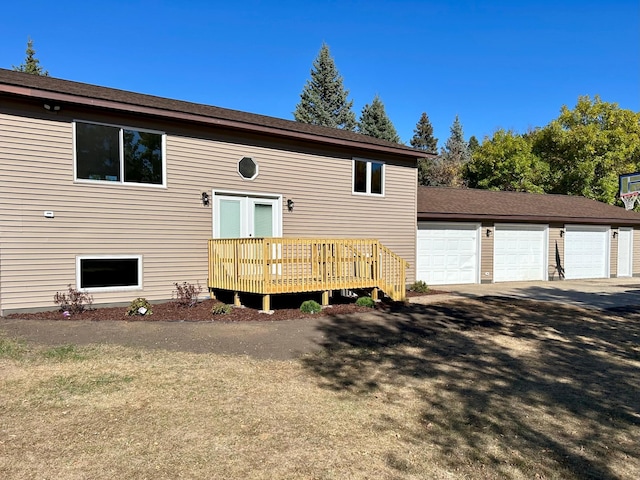 view of front of home featuring a deck and a garage