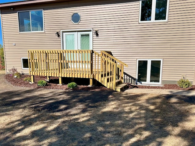 property entrance with a deck