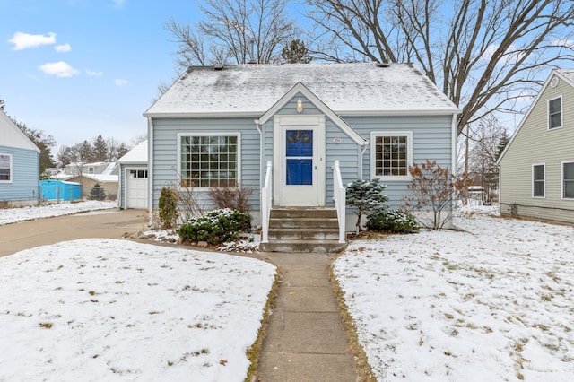 bungalow-style home with a garage