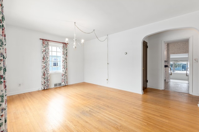 spare room with light wood-type flooring