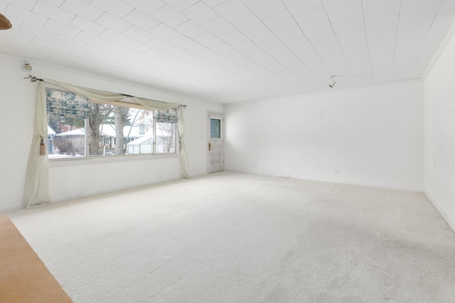 empty room with carpet and ornamental molding