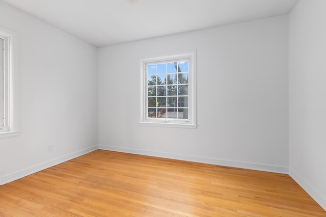 unfurnished room featuring light hardwood / wood-style floors