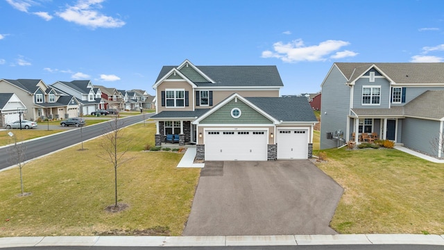 view of front of home featuring a garage, a porch, and a front yard