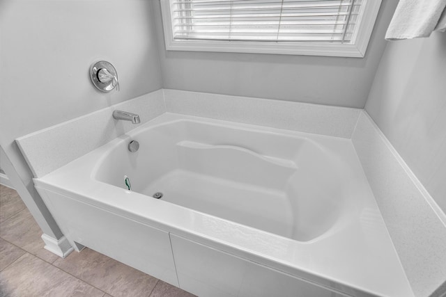 bathroom featuring a bathtub and tile patterned flooring