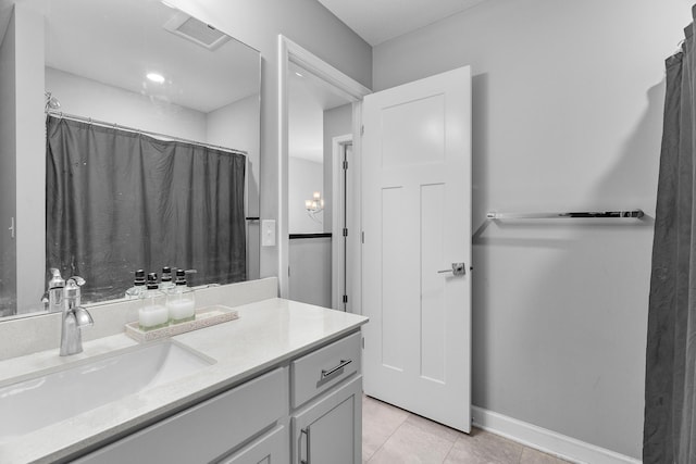 bathroom featuring vanity, a shower with shower curtain, and tile patterned flooring