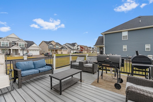 deck with an outdoor hangout area and grilling area