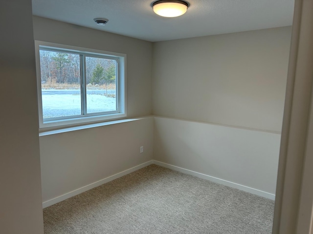 empty room featuring light carpet