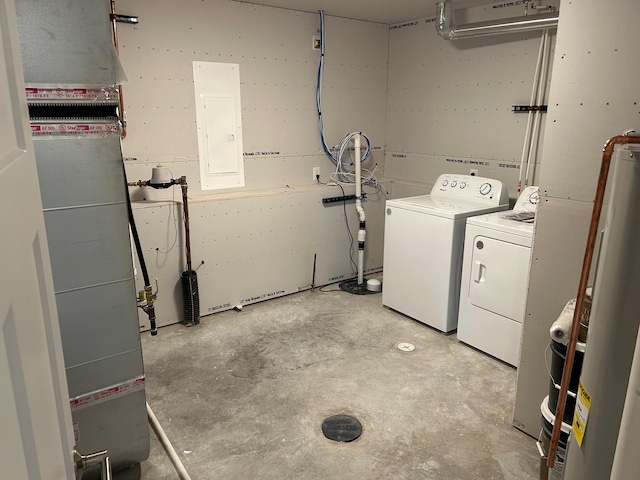 laundry area featuring gas water heater, independent washer and dryer, electric panel, and heating unit