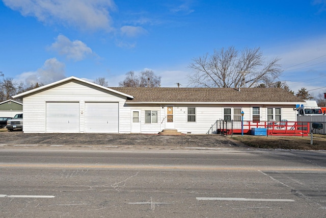 ranch-style house featuring a garage