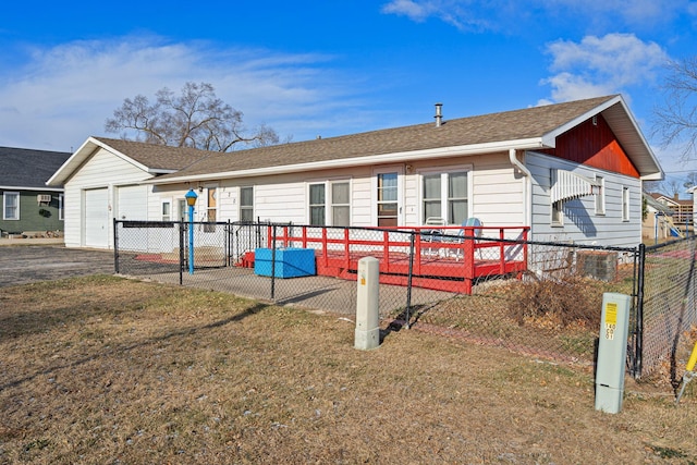 exterior space with a yard and a garage