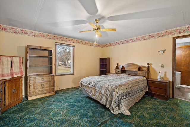 bedroom with ceiling fan and dark colored carpet